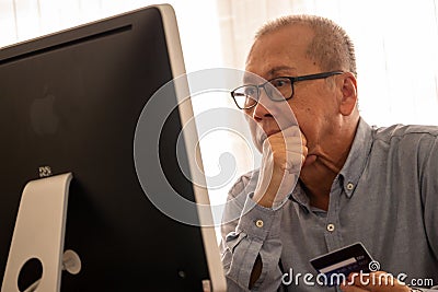 Businessman doing financial transactions by computer at the office room Stock Photo