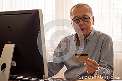 Businessman doing financial transactions by computer at the office room Stock Photo