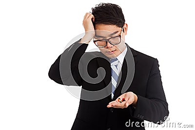 Asian businessman headache with medicine in his hand Stock Photo