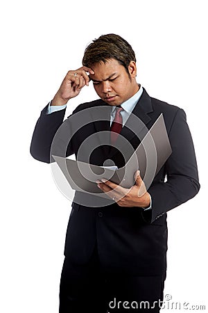 Asian businessman headache read data in a report Stock Photo