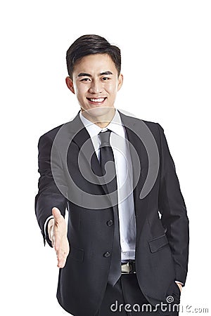 Asian businessman reaching out for handshake Stock Photo