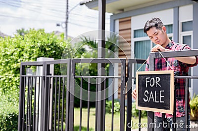 Asian businessman sale his house because of Economic problems. Unemployment and Mental health problem. Corona virus job losses Stock Photo