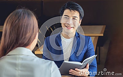 Asian businessman smiling in a friendly to meet business talk Stock Photo