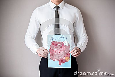 Businessman with ill intestine Stock Photo