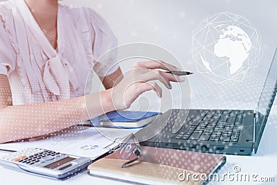 Asian Businessman using computer laptop showing trading graph beside the stock exchange trading graph screen laptop,Profit graph o Stock Photo