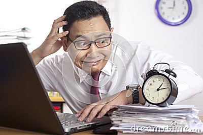 Asian Businessman Worried by Time, Work Deadline Stress Stock Photo