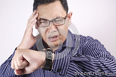 Asian Businessman Worried by Time, Work Deadline Stress Stock Photo