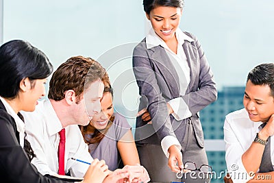 Asian Businesspeople having meeting Stock Photo