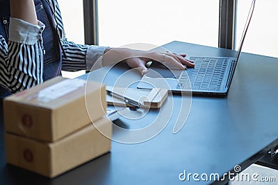 An Asian businesswoman enjoys his online SME business selling products, profiting from opening an online store, and taking orders Stock Photo