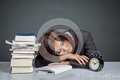 Asian businesswoman get tired reading many books Stock Photo