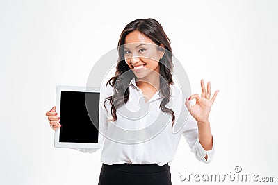 Asian businesswoman holding tablet with blank screen and showing okay Stock Photo