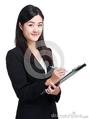 Asian businesswoman take note on clipboard Stock Photo