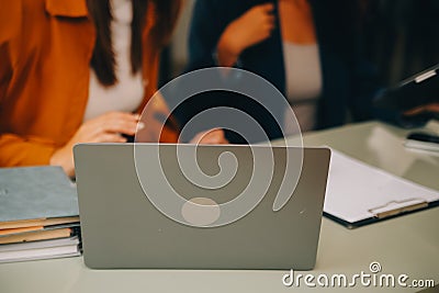 Asian businesswoman working on laptop computer Look for job online, freelance looking and typing on notebook on table, lifestyle Stock Photo