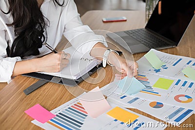 Businesswoman write note on notebook at workplace. startup woman Stock Photo