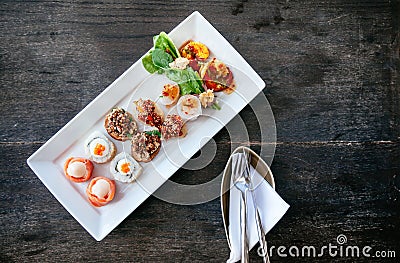 Asian canapes appetizer - Smoked salmon, maki, larb, tuna tartar Stock Photo