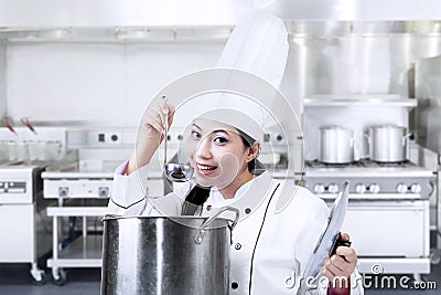 Asian chef tasting food Stock Photo