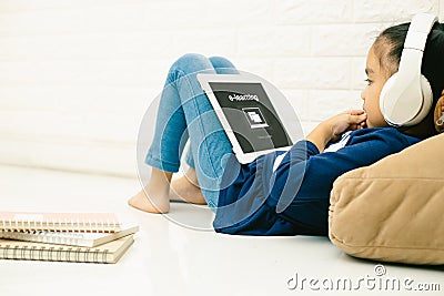 Asian child asian child using laptop with inscription on screen e-learning . Online education,e-learning Stock Photo