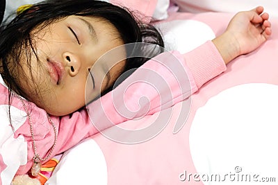 Asian child girl sleeping on a pillow Stock Photo