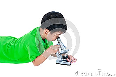 Asian child observed through a microscope biological preparation Stock Photo