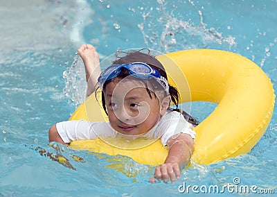 Asian Child Swimming Stock Photo