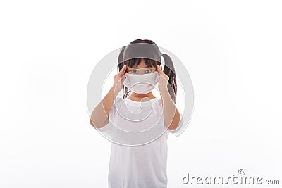 Asian child wearing a medical mask is feeling headache Stock Photo