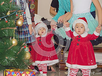 Asian children baby girls twins together at celebration Christmas Stock Photo