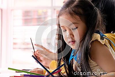 Asian children painting in Art class with teacher, for creati Stock Photo