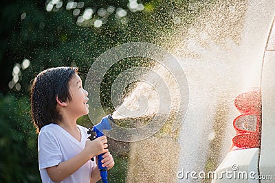 Asian children washing car