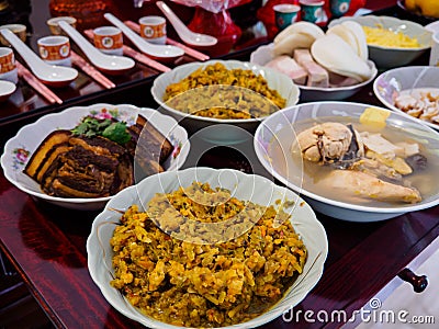 Asian Chinese ancestor worship - food offerings made to ancestors on Dongzhi / Winter solstice Stock Photo