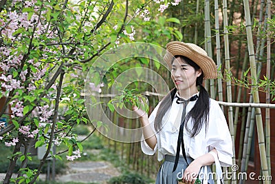 Asian Chinese Happy young cute adorable lovely student youth in a park garden outdoor in summer Stock Photo