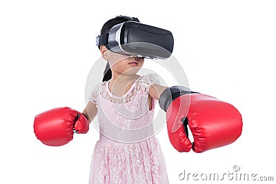 Asian Chinese little girl experiencing virtual reality with boxing gloves Stock Photo