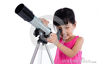 Asian Chinese little girl holding a telescope Stock Photo