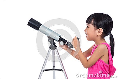 Asian Chinese little girl holding a telescope Stock Photo