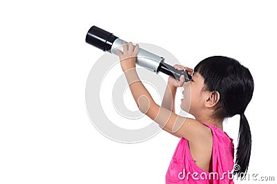 Asian Chinese little girl looking through a telescope Stock Photo