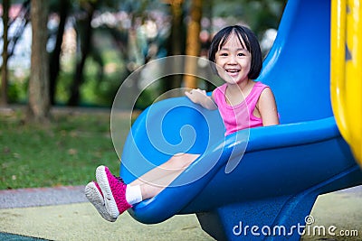 Asian Chinese little girl playing at outdoor playground Stock Photo