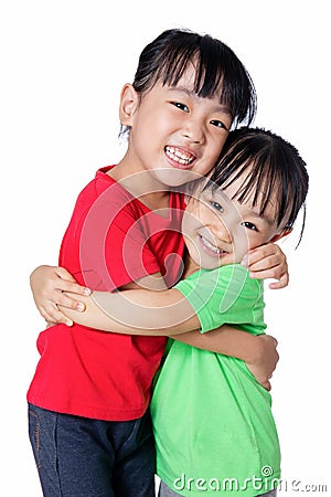 Asian Chinese little girls hugging each other Stock Photo
