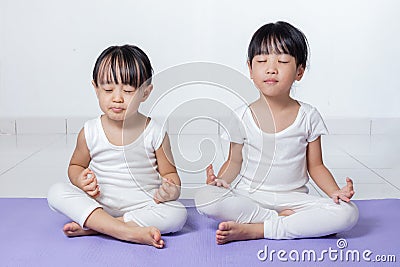 Asian Chinese little girls practicing yoga pose Stock Photo