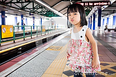 Asian Chinese Little Girls Waiting for Light Rapid Transit Stock Photo