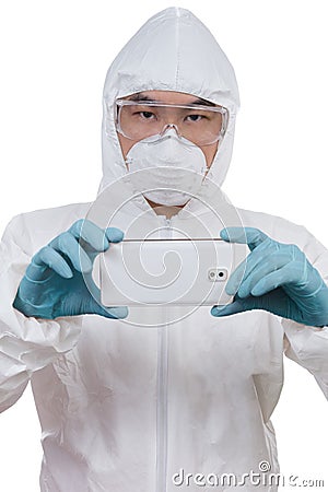 Asian Chinese scientist in protective wear with mobile phone Stock Photo