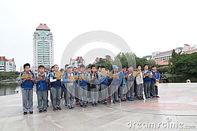 Asian chinese students reading a book. Nine, focus Editorial Stock Photo