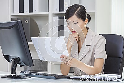 Asian Chinese Woman or Businesswoman in Office Stock Photo