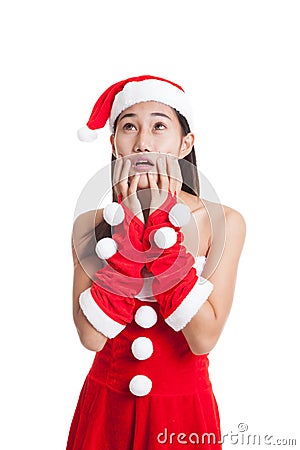 Asian Christmas Santa Claus girl shock and look up. Stock Photo