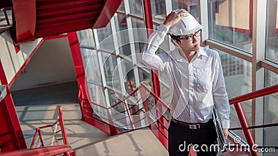 Asian civil engineer man working at construction site Stock Photo