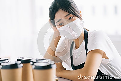 The Asian coffee shop owners were upset because their shops were closed due to the effects of the disease Stock Photo