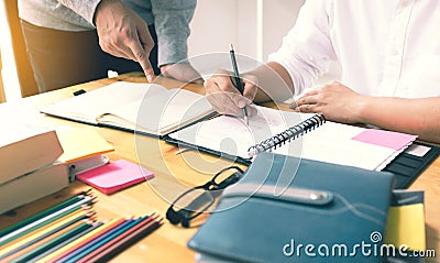 Asian college students making lesson notes in university. Stock Photo