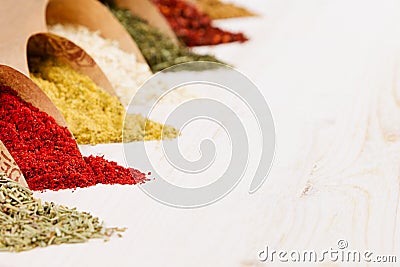 Asian colorful powder spices close up on white wooden board with copy space. Stock Photo