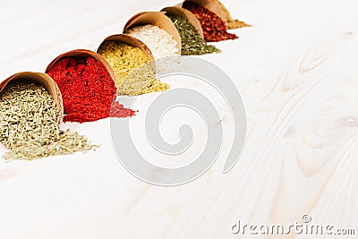 Asian colorful powder spices close up on white wooden board with copy space. Stock Photo