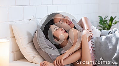 Asian couple lesbian wake up in morning at bed in ozy home Stock Photo