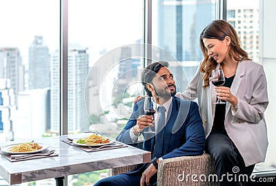 Asian couple lover dating and take a linch in Italian restaurant Stock Photo