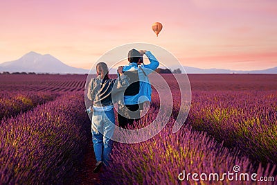 Asian couple travel in lavender field Stock Photo